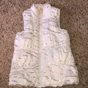 White zip up vest with silver stripes
